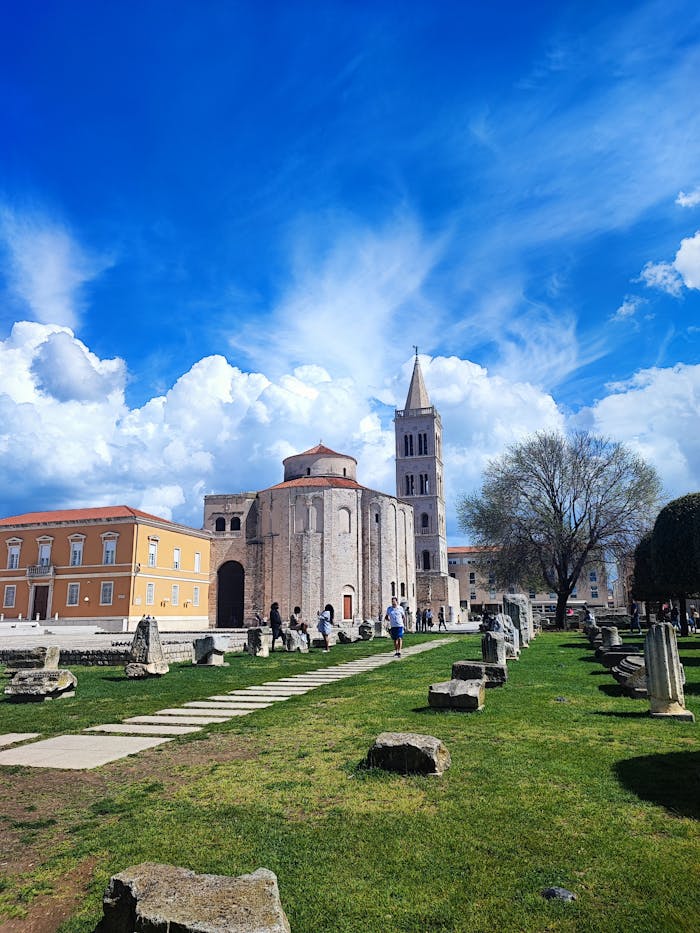 Explore the stunning historical architecture of St. Donatus Church in Zadar, Croatia, under a vibrant sky.